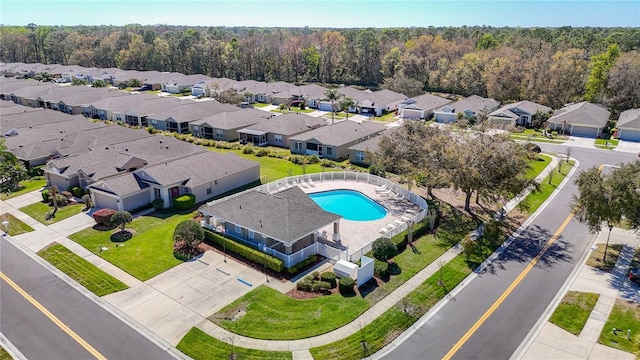 birds eye view of property featuring a residential view and a view of trees