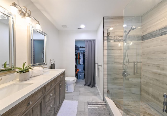 full bathroom featuring a shower stall, visible vents, and a sink