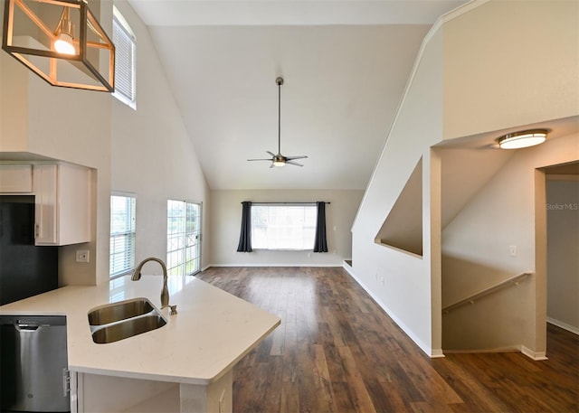 9730 Lake Chase Island Way Unit 9730, Tampa, FL 33626 - kitchen featuring stainless steel dishwasher, dark wood finished floors, a ceiling fan, high vaulted ceiling, and light stone counters