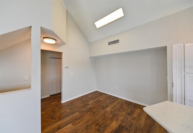 9730 Lake Chase Island Way Unit 9730, Tampa, FL 33626 - unfurnished room featuring vaulted ceiling and wood finished floors