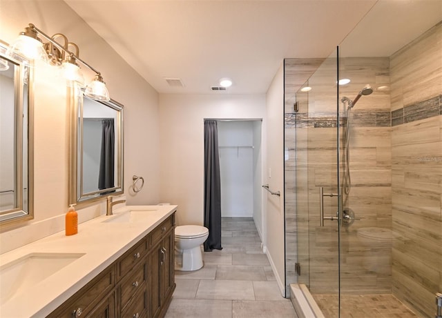 9730 Lake Chase Island Way Unit 9730, Tampa, FL 33626 - bathroom featuring a shower stall, double vanity, and recessed lighting