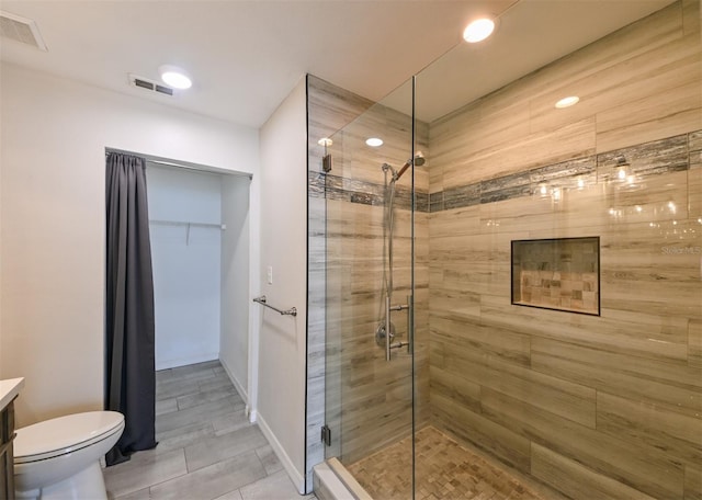 9730 Lake Chase Island Way Unit 9730, Tampa, FL 33626 - full bath with a shower stall, vanity, and a walk in closet