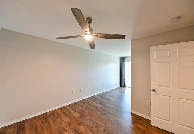9730 Lake Chase Island Way Unit 9730, Tampa, FL 33626 - spare room with a smoke detector, dark wood-type flooring, and a ceiling fan