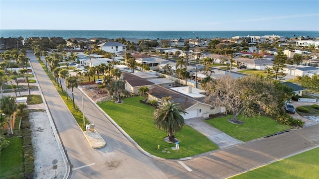 bird's eye view with a water view and a residential view