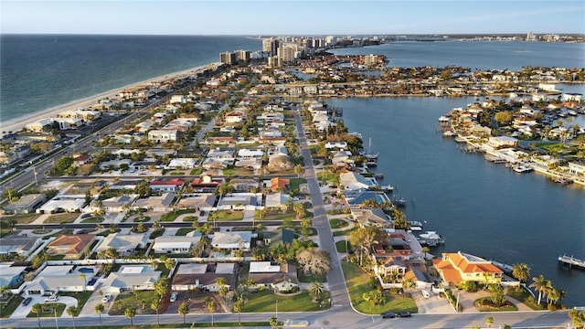 birds eye view of property with a water view and a residential view