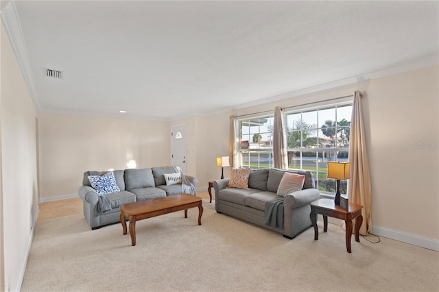 carpeted living room featuring visible vents, crown molding, and baseboards