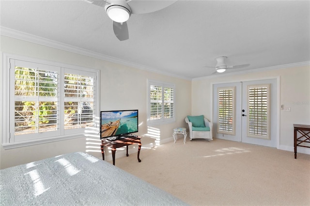 bedroom featuring ceiling fan, baseboards, ornamental molding, french doors, and carpet