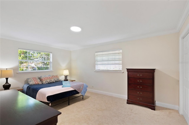 carpeted bedroom featuring baseboards and crown molding