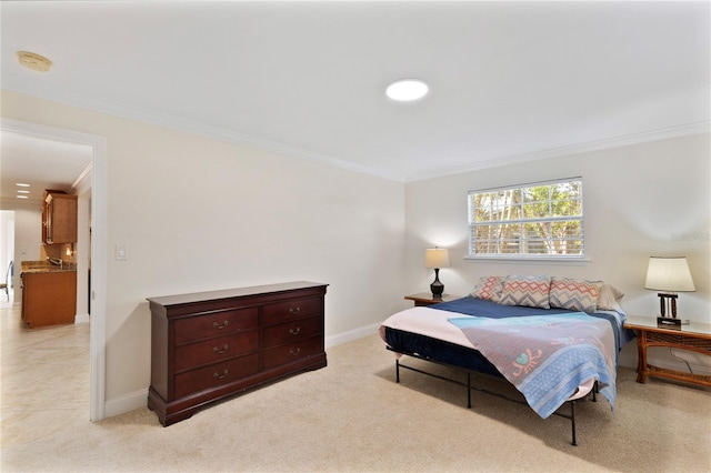 bedroom featuring light carpet, crown molding, and baseboards