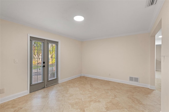 empty room featuring french doors, visible vents, and baseboards