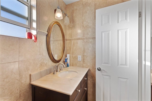 bathroom with tile walls and vanity