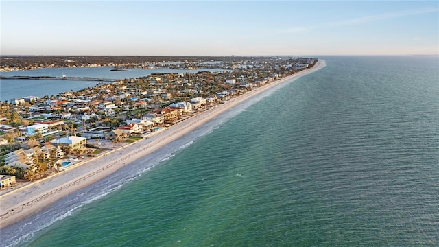 bird's eye view with a water view and a beach view