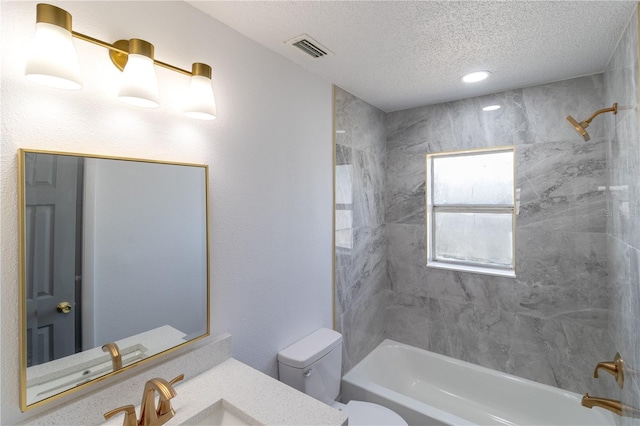 bathroom with visible vents, tub / shower combination, toilet, a textured ceiling, and vanity