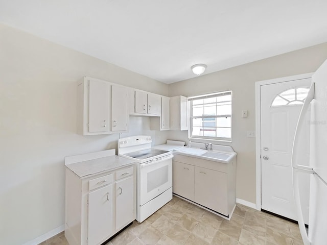 kitchen with white electric stove, white cabinetry, a sink, and light countertops