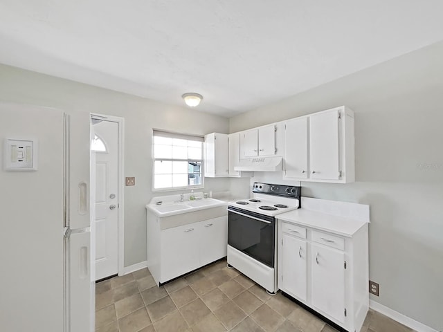 kitchen featuring under cabinet range hood, white appliances, white cabinets, and light countertops