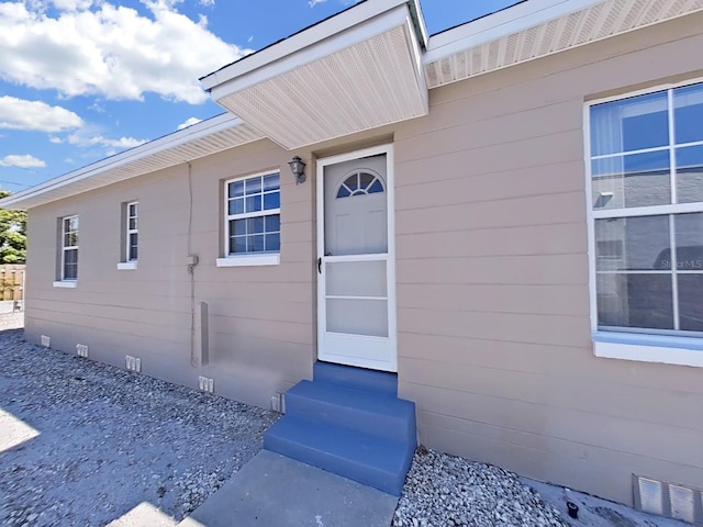 doorway to property featuring visible vents