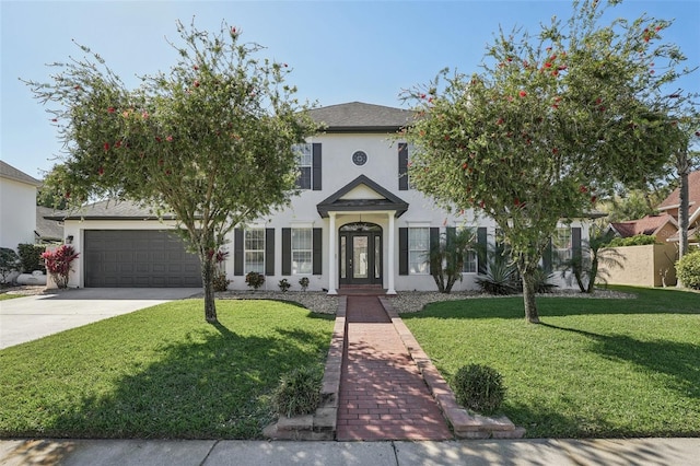 view of front of property featuring stucco siding, a front lawn, fence, concrete driveway, and an attached garage