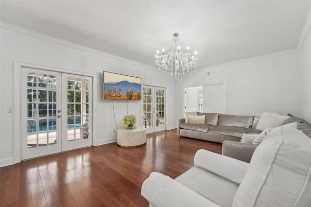 living area with ornamental molding, french doors, a textured ceiling, and wood-type flooring