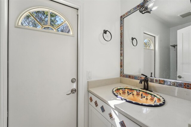 bathroom featuring vanity and visible vents