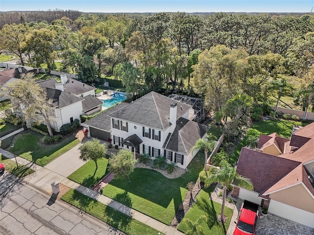 aerial view featuring a view of trees