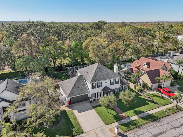 drone / aerial view featuring a view of trees