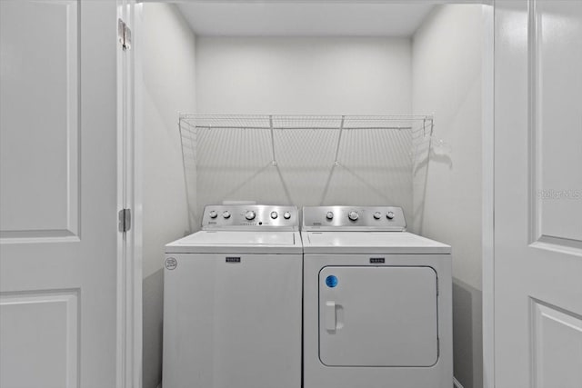 washroom with laundry area and washing machine and clothes dryer