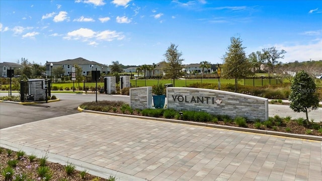 community / neighborhood sign featuring a residential view