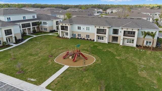 birds eye view of property with a residential view