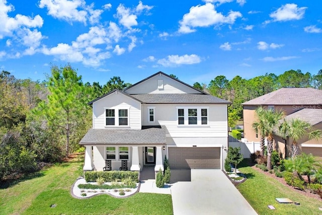 view of front of property featuring an attached garage, covered porch, fence, driveway, and a front yard