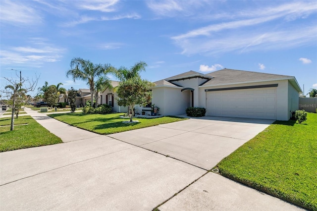 view of front of property with an attached garage, concrete driveway, a front yard, and stucco siding