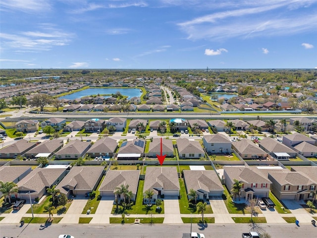 bird's eye view featuring a residential view and a water view