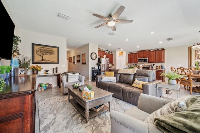 living room featuring recessed lighting, visible vents, and a ceiling fan