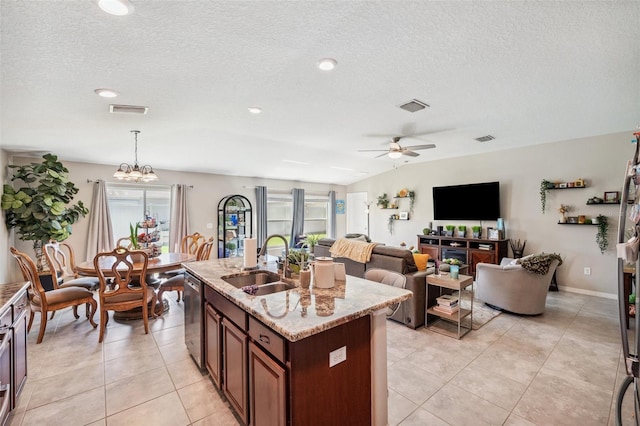 kitchen with dishwashing machine, a sink, visible vents, and a healthy amount of sunlight