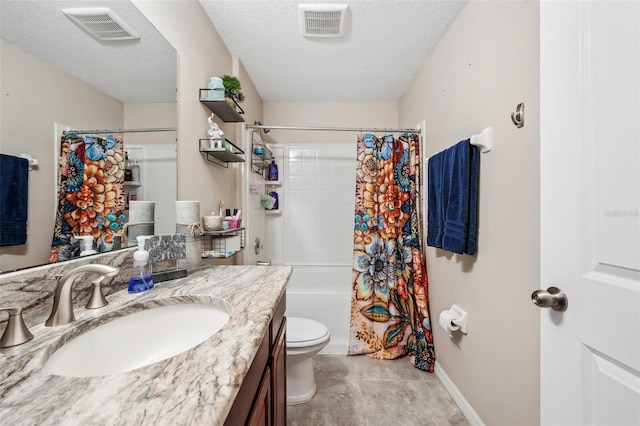 full bathroom featuring toilet, visible vents, a textured ceiling, and vanity