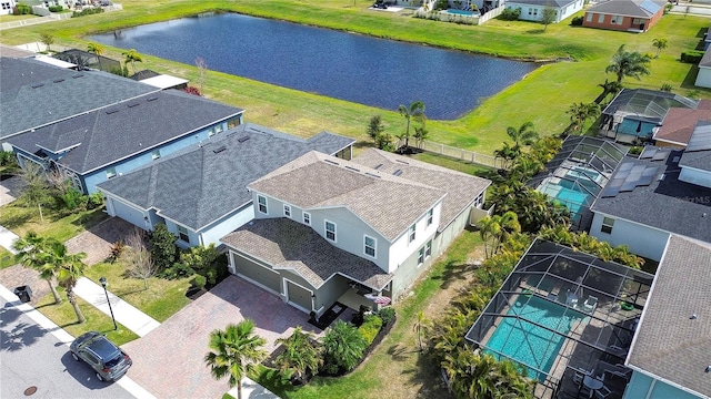 birds eye view of property with a water view and a residential view