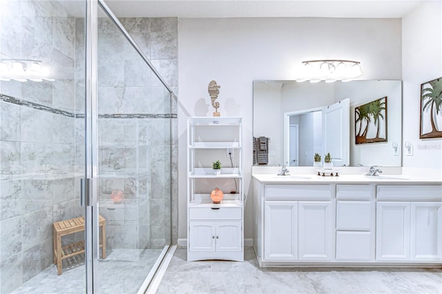 full bathroom featuring a stall shower, a sink, and double vanity