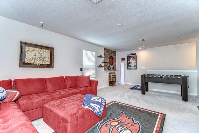 living room with baseboards, a textured ceiling, visible vents, and carpet flooring