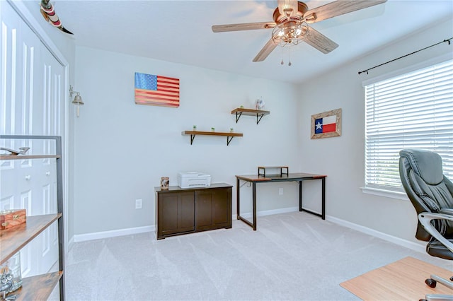 11605 Cleyera Ct, Riverview, FL 33579 - office area featuring ceiling fan, light colored carpet, healthy amount of natural light, and baseboards