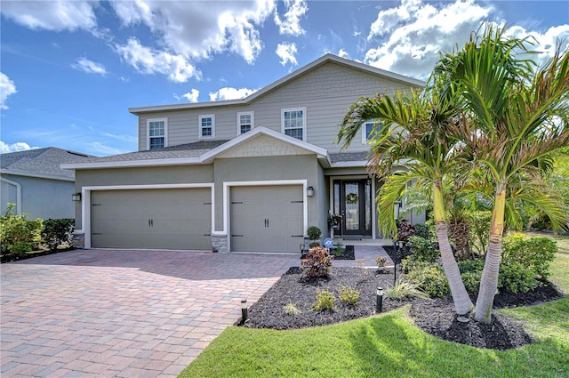 11605 Cleyera Ct, Riverview, FL 33579 - view of front of home featuring driveway, an attached garage, and stucco siding