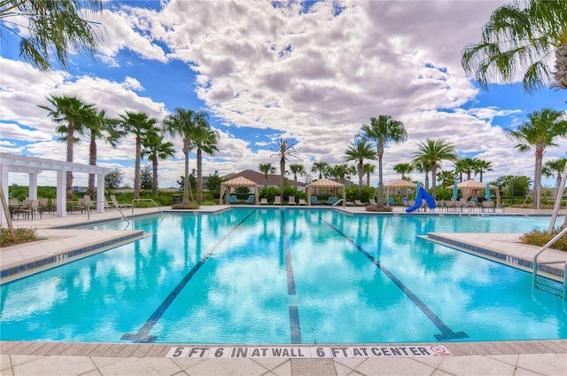 11605 Cleyera Ct, Riverview, FL 33579 - community pool with a pergola, a patio area, and a water slide