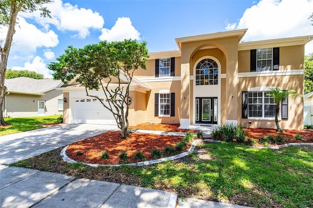 view of front of home with driveway and stucco siding