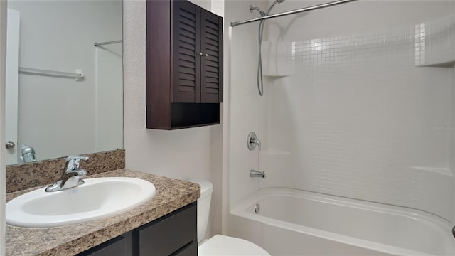 bathroom with vanity, shower / tub combination, and toilet