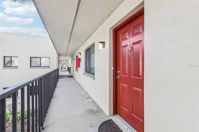 view of exterior entry featuring stucco siding