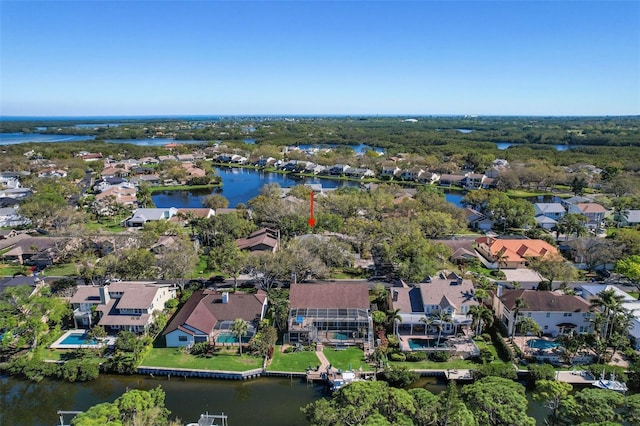 aerial view with a residential view and a water view