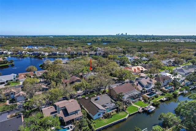 birds eye view of property with a residential view and a water view