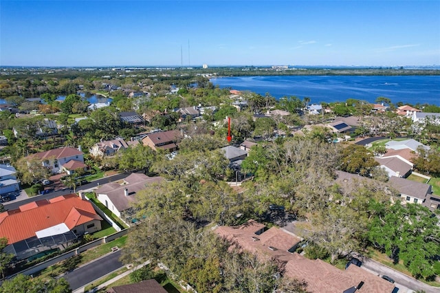 drone / aerial view with a residential view and a water view