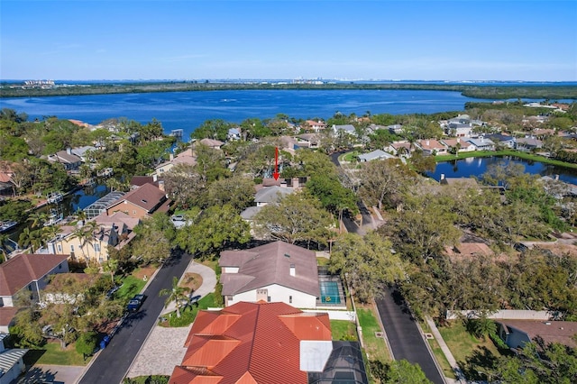 drone / aerial view with a residential view and a water view