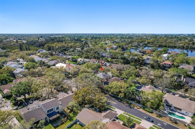 drone / aerial view featuring a residential view and a water view