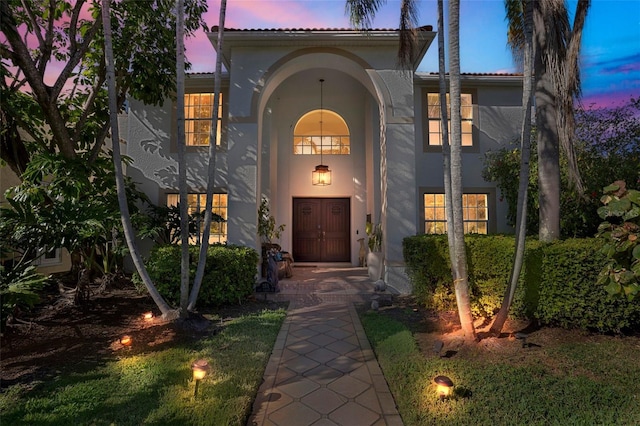 mediterranean / spanish-style house with stucco siding