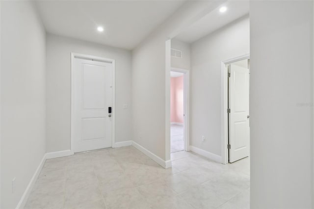 interior space featuring baseboards, visible vents, and recessed lighting